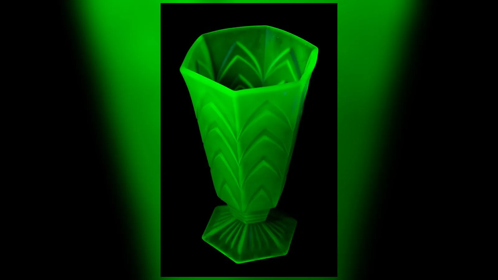Green uranium depression glass glowing under ultraviolet light